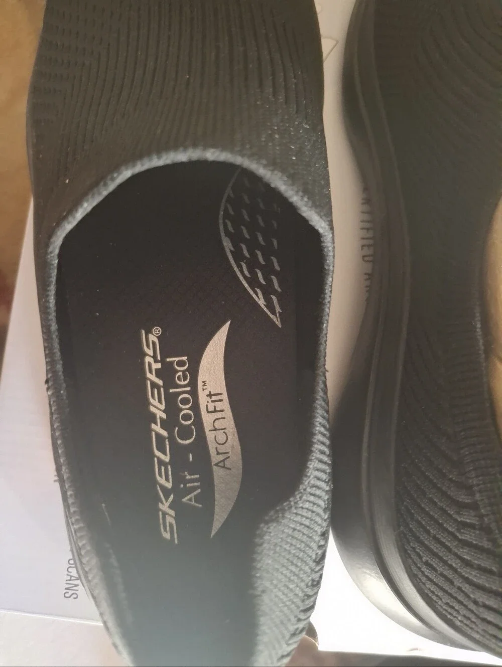 Skechers Arch Fit Slip-On Knit Sneakers in Black